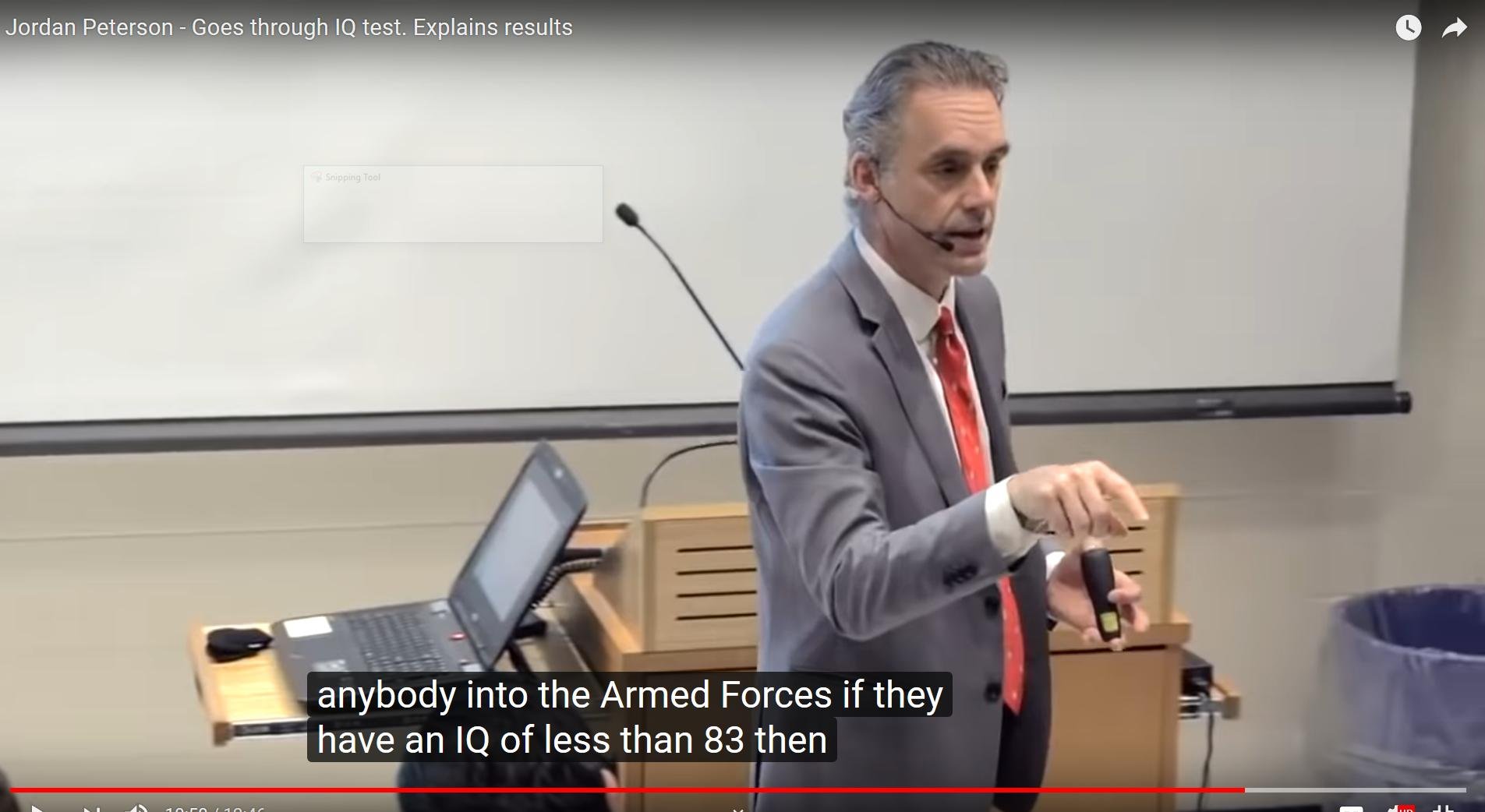 a screenshot of the video linked above, showing Peterson speaking in a lecture theatre