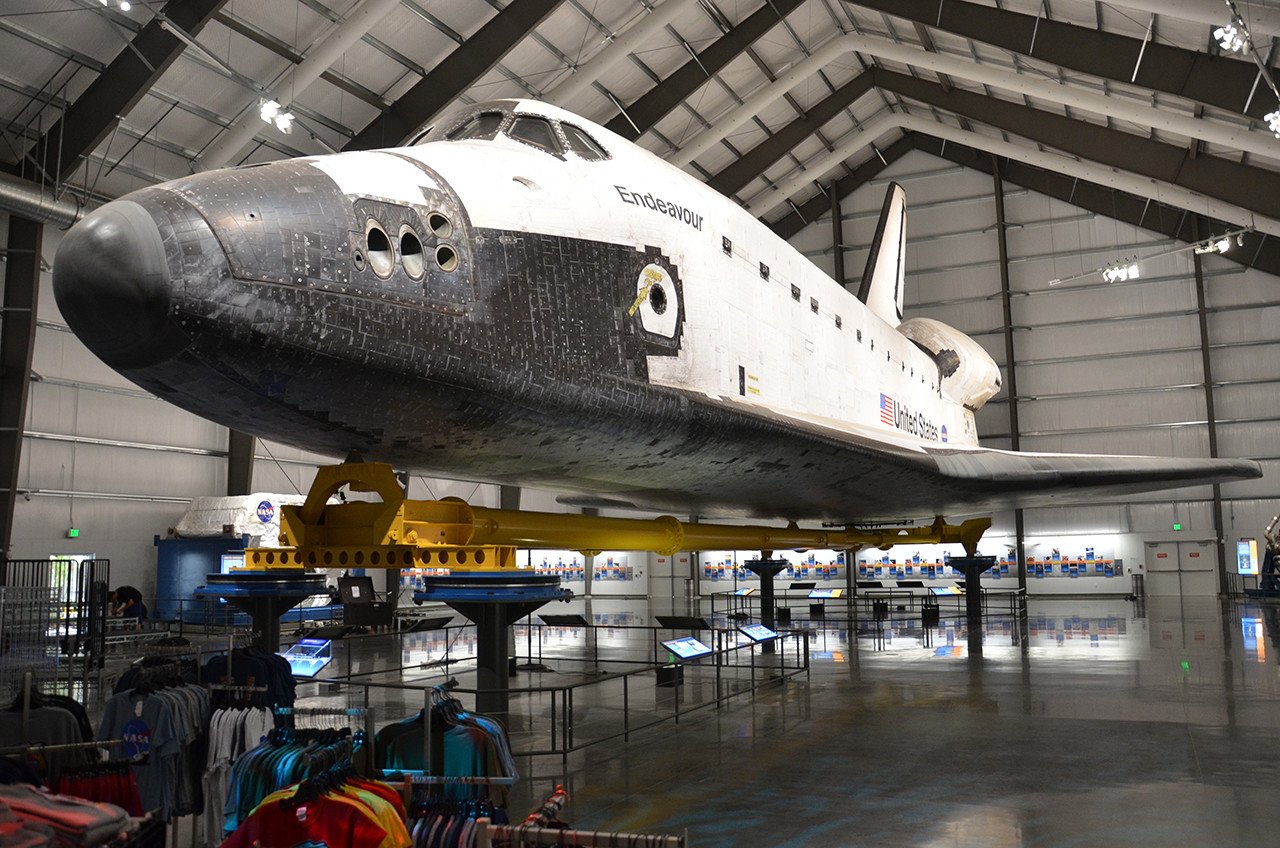A photograph of the Space Shuttle in its temporary exhibit hall.